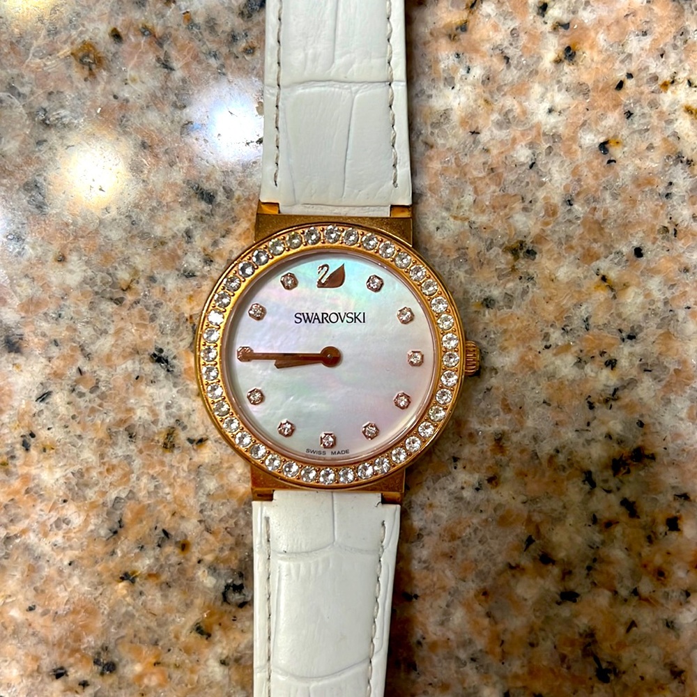 Swarovski white leather and rose gold colored watch